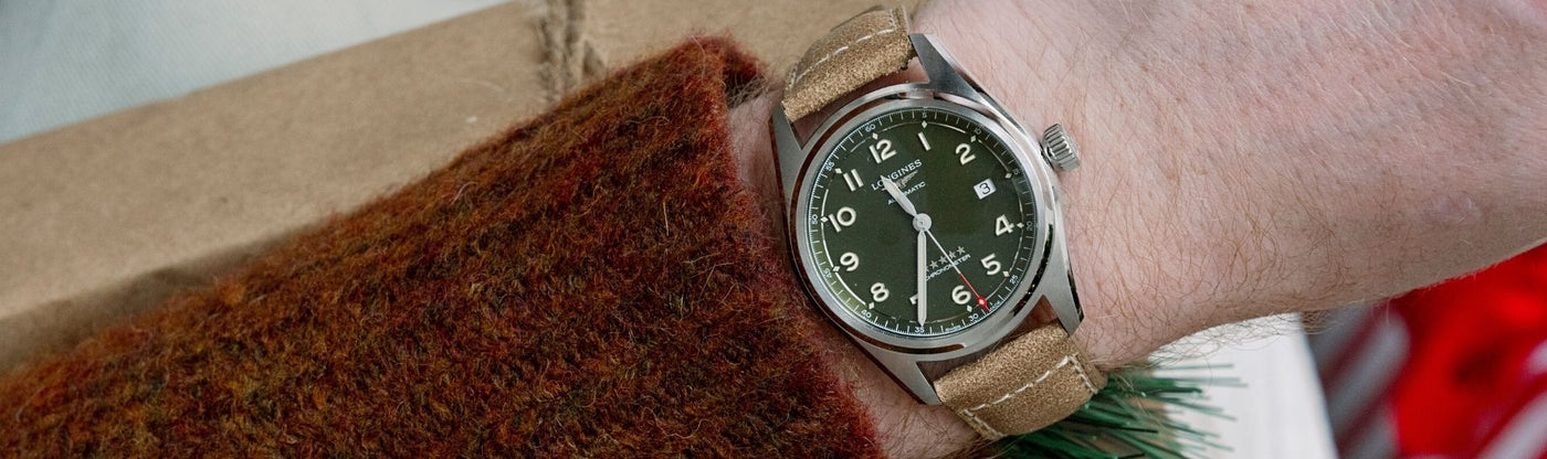 Longines watch with green dial and leather strap