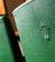 Close Up of Rolex Crown Logo on Green Chair Back