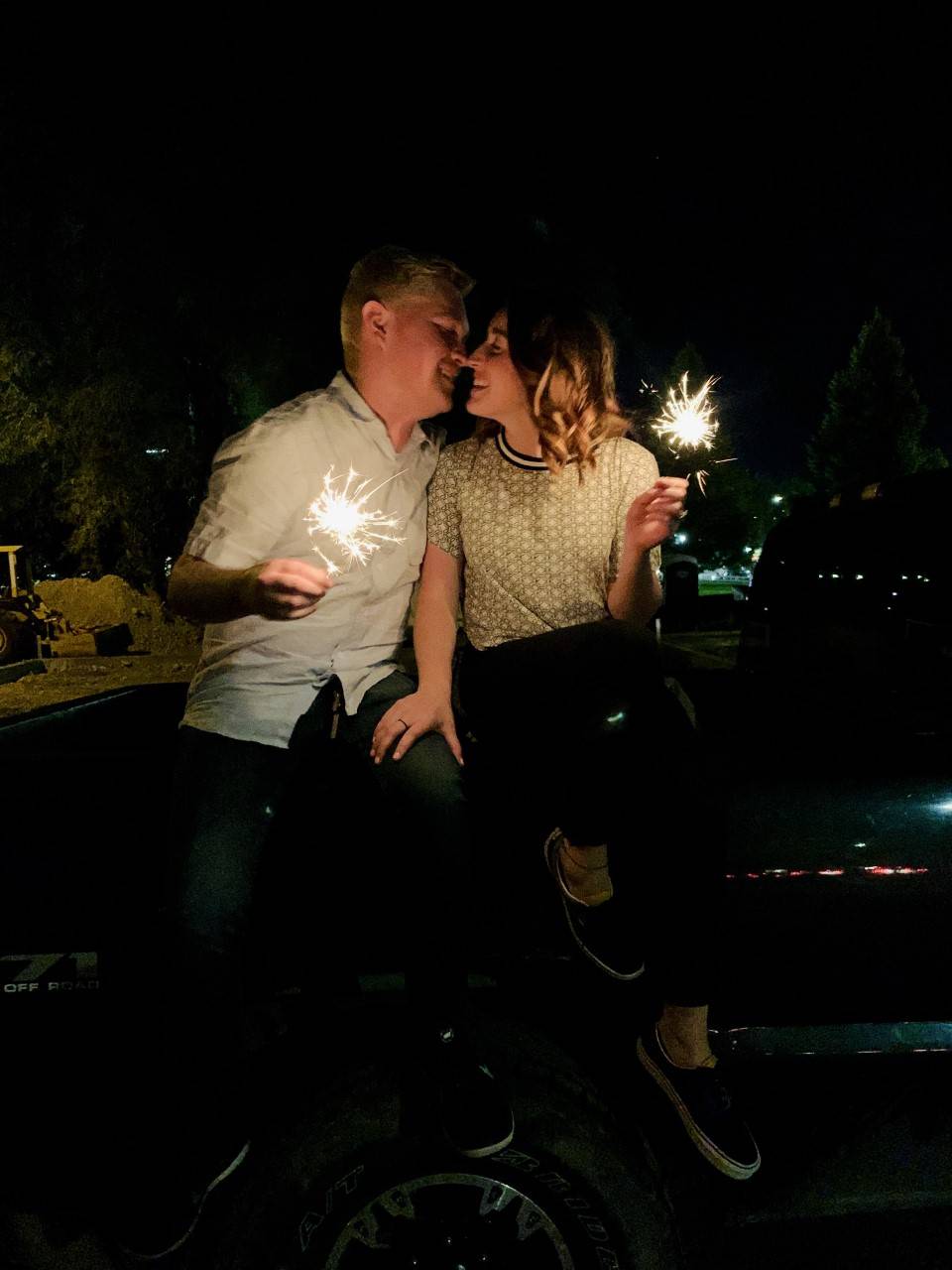 Henne Engagement Ring Couple Ethan & Maddie Share a Kiss Holding Sparklers