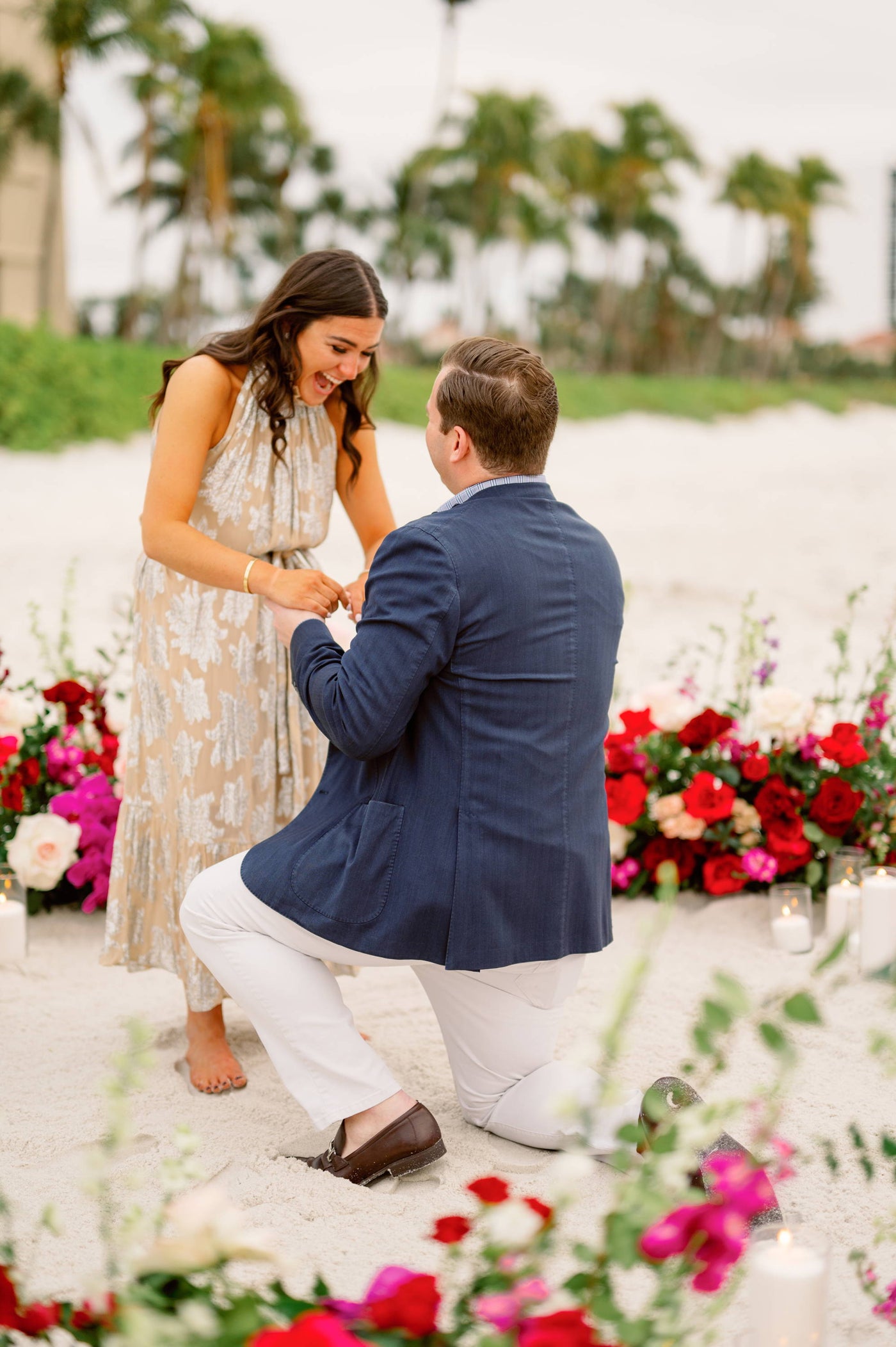 Dennis Proposing to Olivia on the Beach with an Engagement Ring from Henne Jewelers