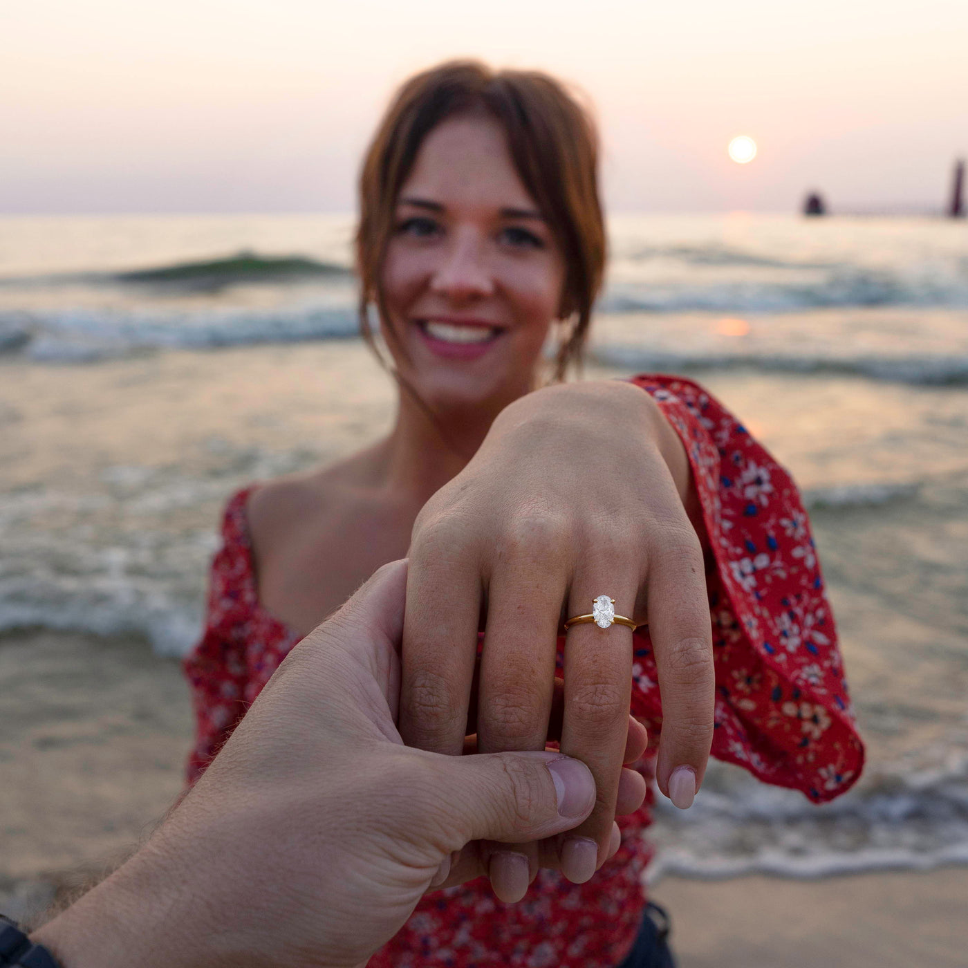 Close Up of Natalie on the Beach Showing off Her Engagement Ring from Henne Jewelers