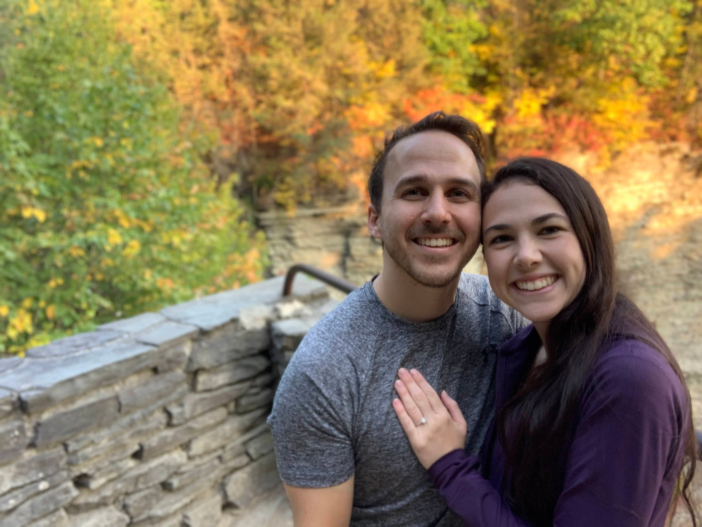 Henne Engagement Ring Couple Zach & Dominique Smile Amidst The Fall Leaves Changing Color