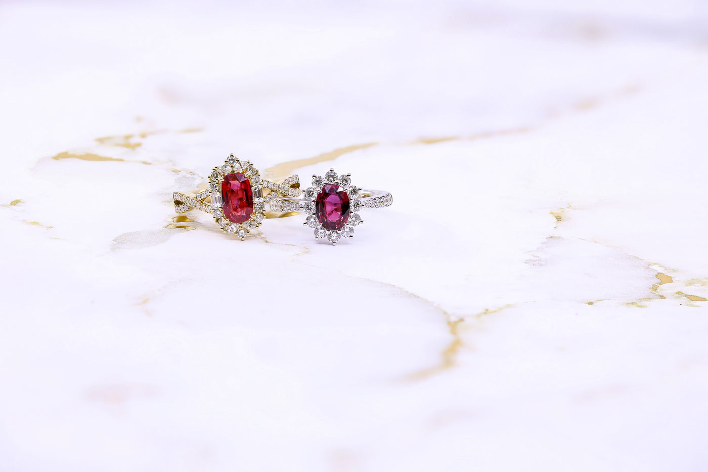 two ruby rings with marble background