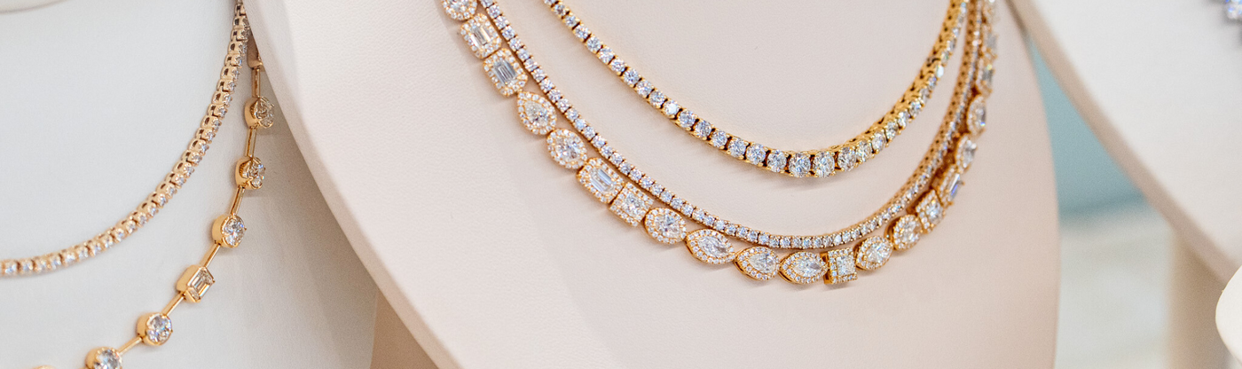 diamond tennis necklaces in jewelry case