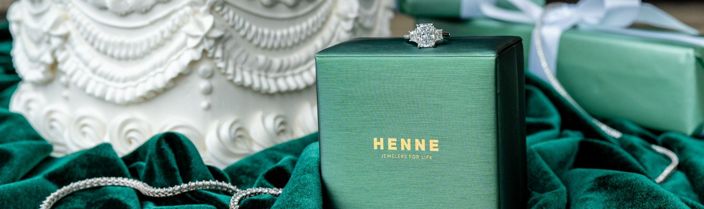 Henne box with tennis necklace and Oakmont Bakery cake