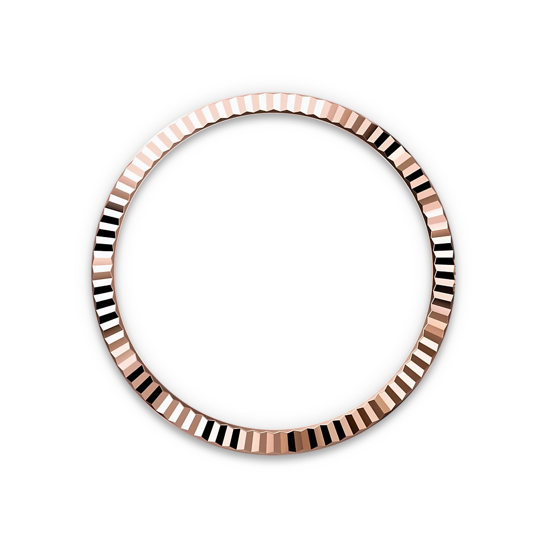 Rose gold bezel ring with a textured, faceted surface reflecting light against a black background, highlighting fine craftsmanship and luxury jewelry design.