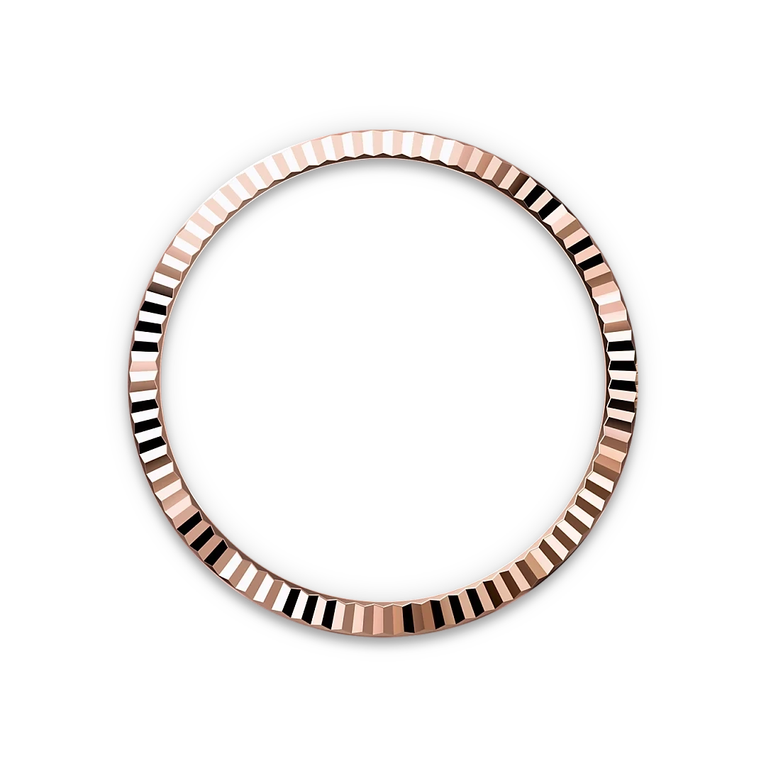 Rose gold circular bezel with faceted edges creating a reflective, textured pattern against a black background, emphasizing fine jewelry craftsmanship.