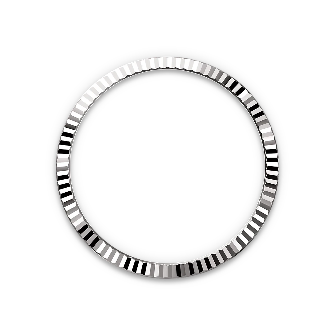 Close-up of a polished, textured silver bezel ring with reflective facets, set against a black background, highlighting its elegant craftsmanship.