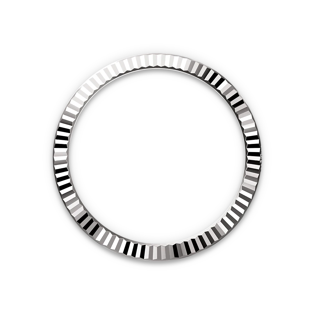Close-up of a polished, ridged silver bezel ring with alternating smooth and textured segments on a black background, highlighting fine jewelry craftsmanship.
