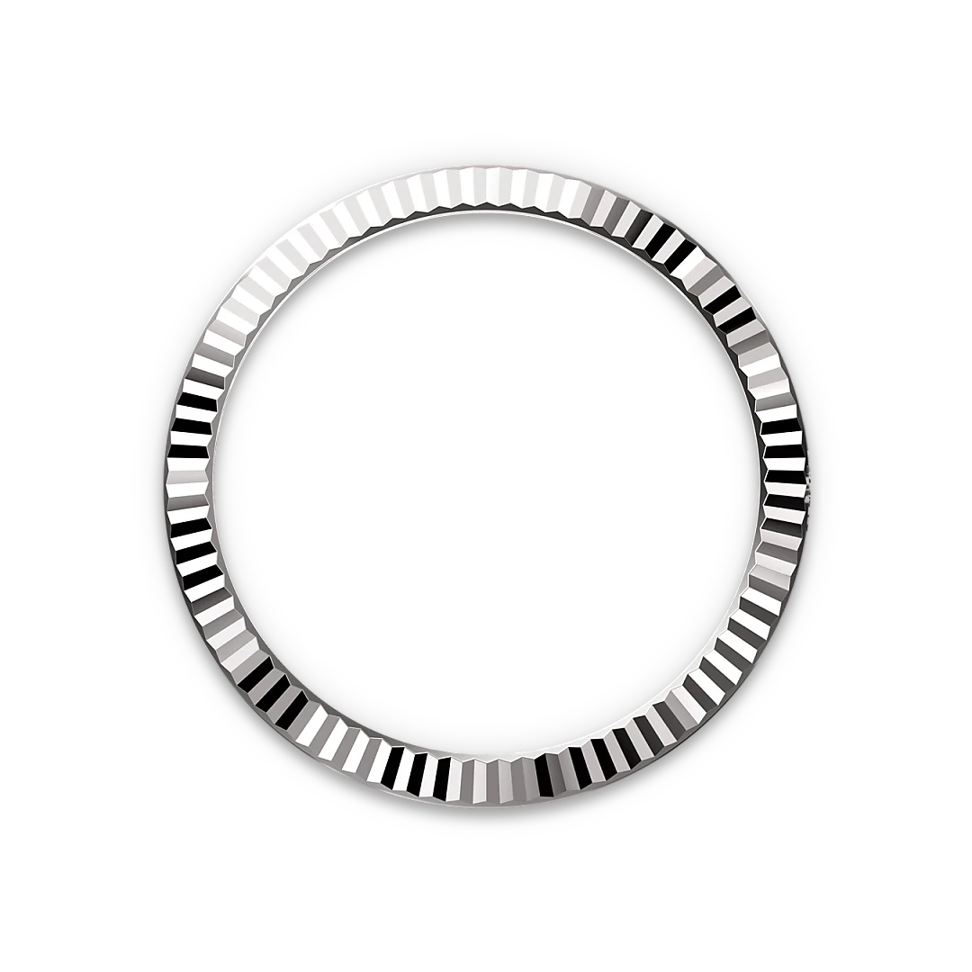 A polished, silver-toned circular bezel with a fluted, reflective surface set against a black background, highlighting its luxury craftsmanship and precision.
