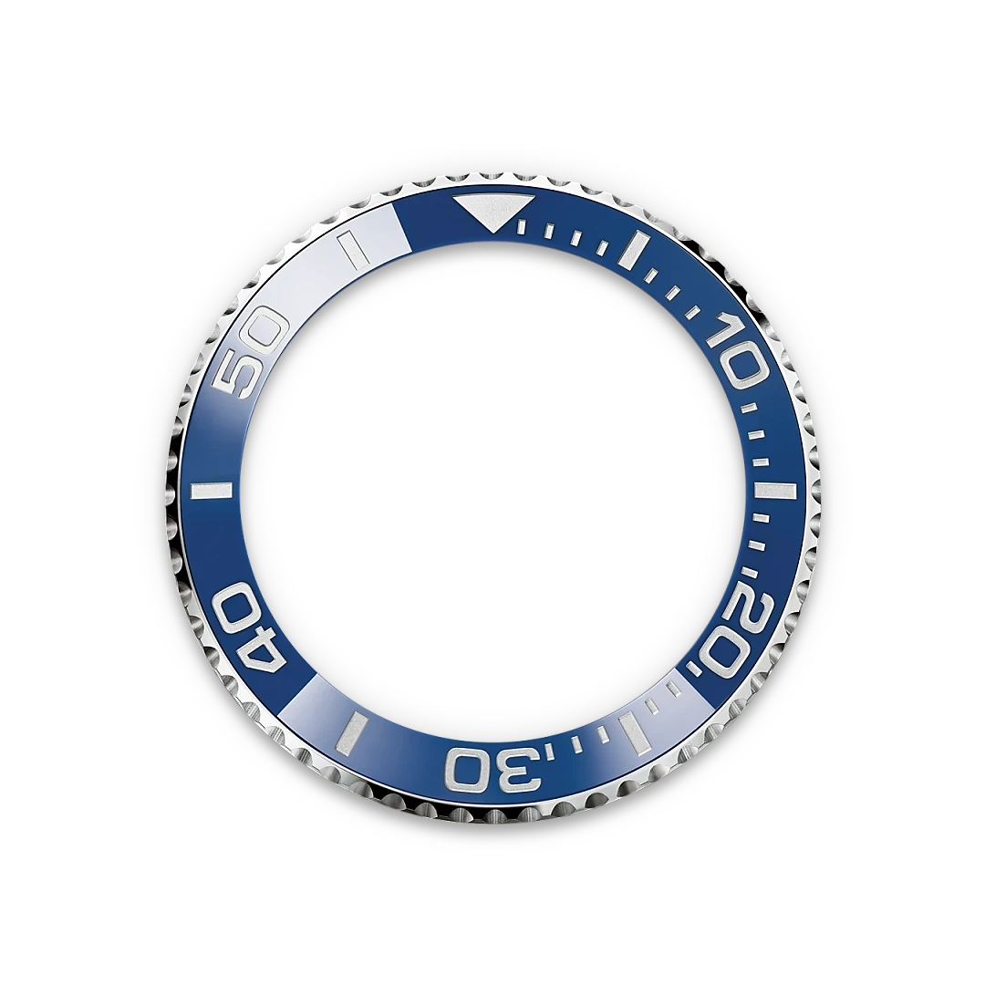 A close-up of a blue and silver watch bezel with minute markers and numerals, designed for luxury watches, highlighting precise craftsmanship and elegant details.