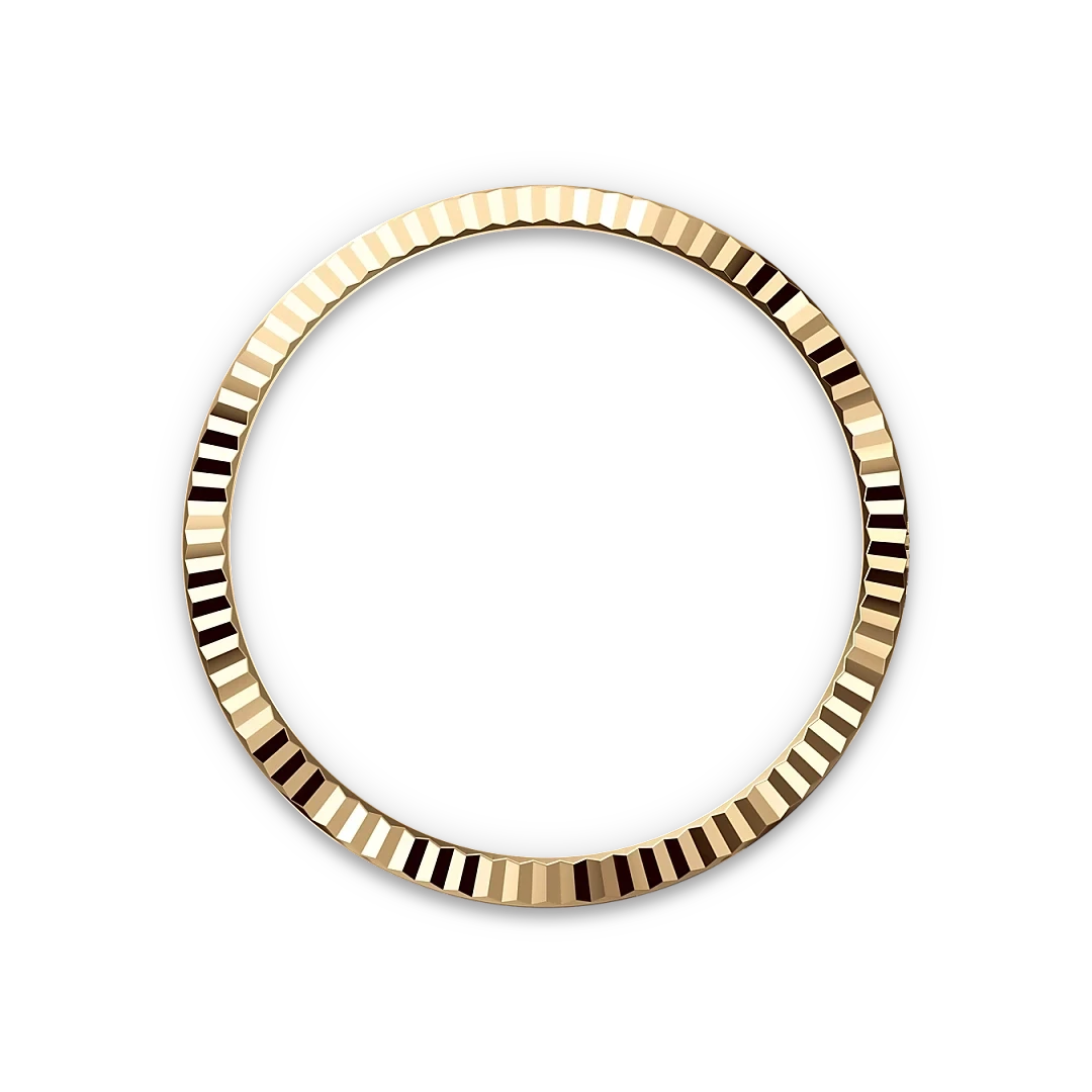 A shiny gold bezel ring with a ridged texture, displayed against a black background, reflecting light to highlight its luxurious finish.