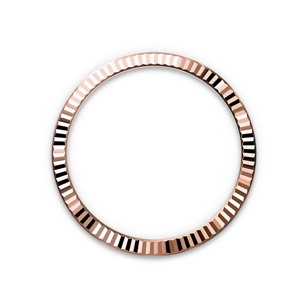 Rose gold bezel ring with a textured, faceted surface creating a reflective pattern, set against a black background, showcasing fine craftsmanship and luxury jewelry design.