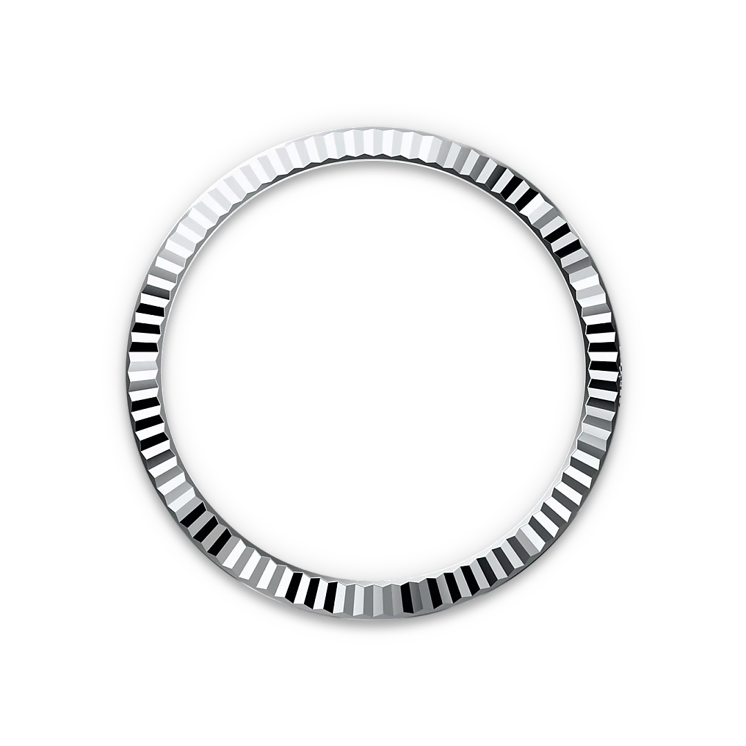 Close-up of a shiny, silver fluted bezel ring used in luxury watch designs, displayed against a black background, highlighting its polished texture.