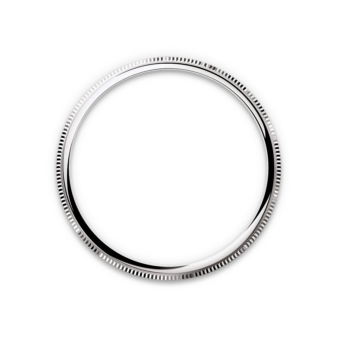Close-up of a polished silver bezel ring with fine ridged detailing around the edge, set against a plain black background, highlighting craftsmanship and precision.