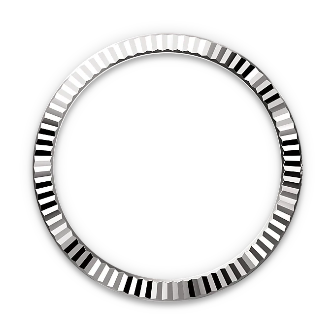 Close-up of a polished silver bezel with a fluted, reflective edge set against a black background, showcasing fine craftsmanship and luxury jewelry design.