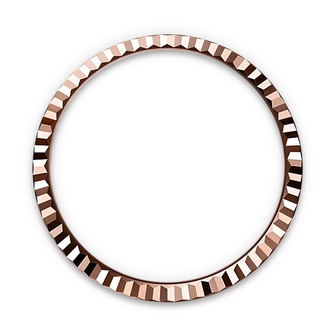 Rose gold bezel ring with a faceted, geometric pattern displayed against a black background, highlighting fine craftsmanship and luxury jewelry design.
