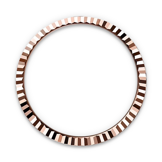 Close-up of a polished rose gold bezel with a faceted edge design, displayed against a black background, highlighting its fine craftsmanship and luxury style.