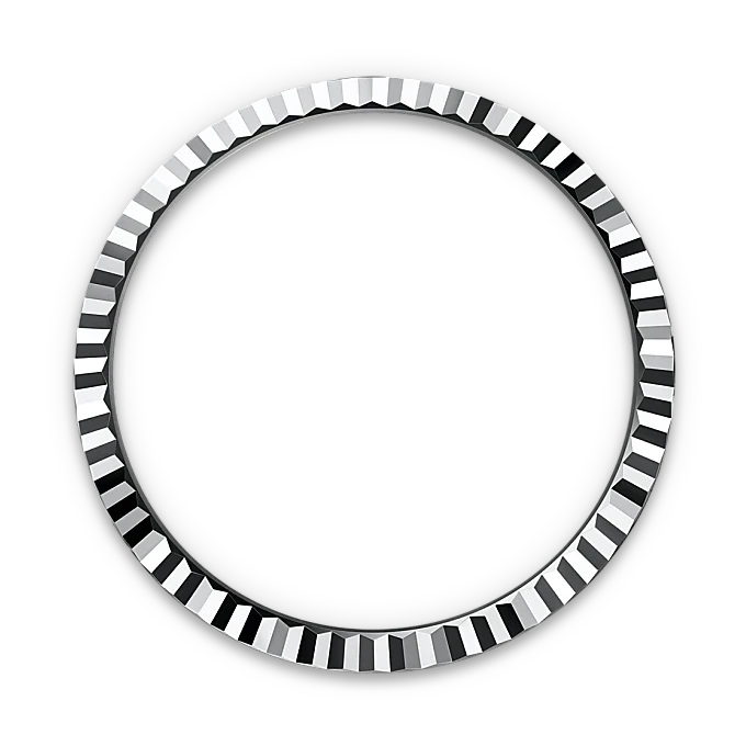 Close-up of a faceted, polished metal bezel ring with a ridged, reflective surface, shown against a black background, highlighting its fine craftsmanship and luxury design.