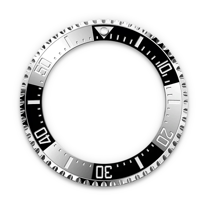 Close-up of a polished silver and black bezel with minute markings, designed for a luxury watch such as a Rolex, highlighting fine craftsmanship and precision.