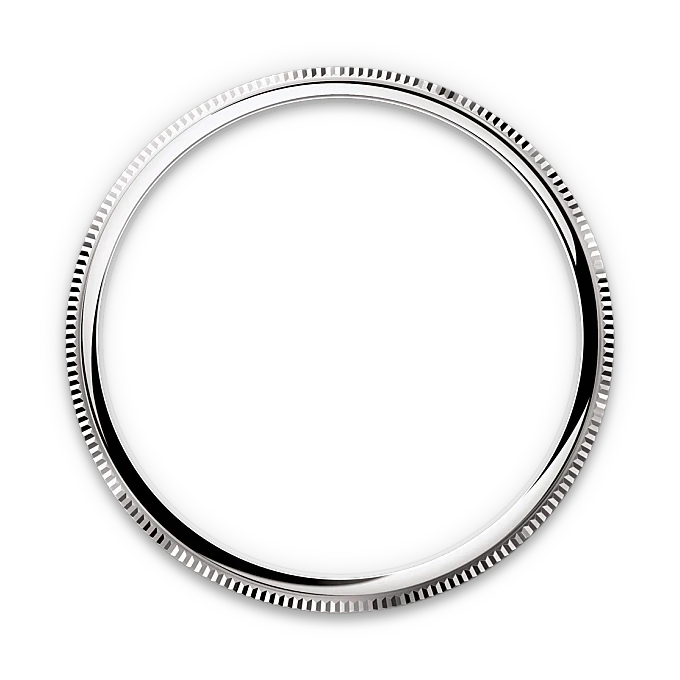 Close-up of a polished silver bezel with fine ridged edges, highlighting craftsmanship and detail in luxury watch components.