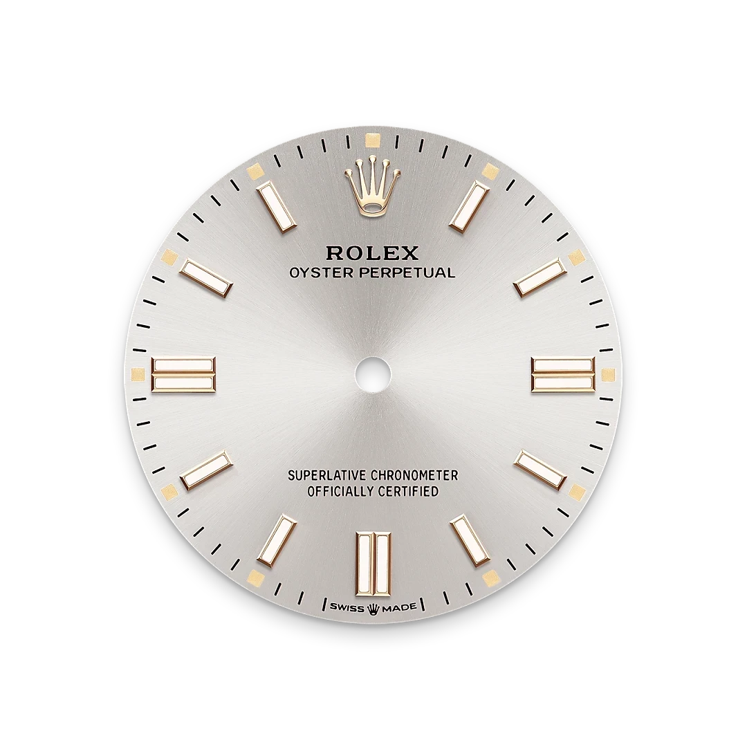 Rolex Oyster Perpetual watch dial with gold hour markers and the Rolex crown logo, labeled as a superlative chronometer and officially certified Swiss made timepiece.