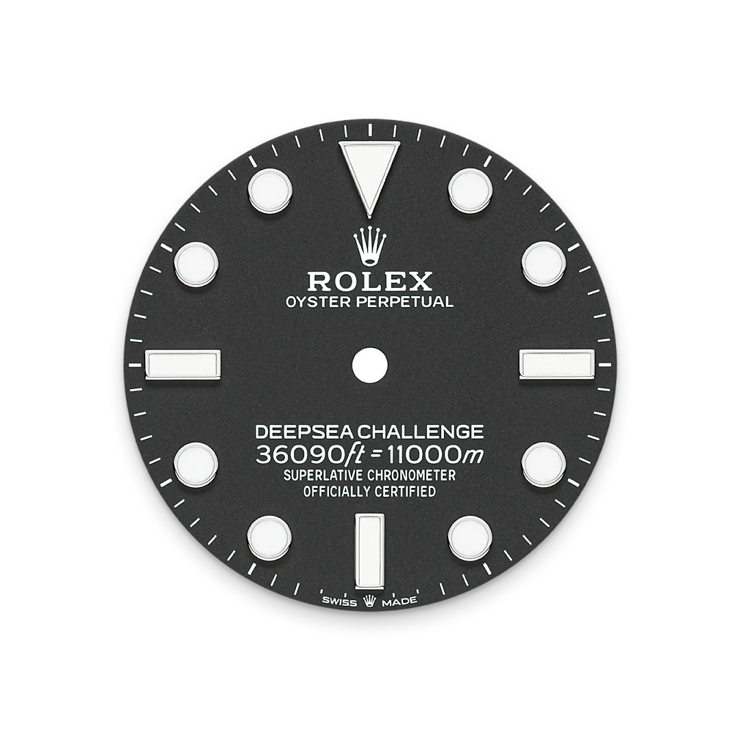 Close-up of a Rolex Deepsea Challenge watch dial featuring luminous hour markers, the Rolex crown logo, and text indicating water resistance to 11,000 meters, emphasizing luxury and precision craftsmanship.
