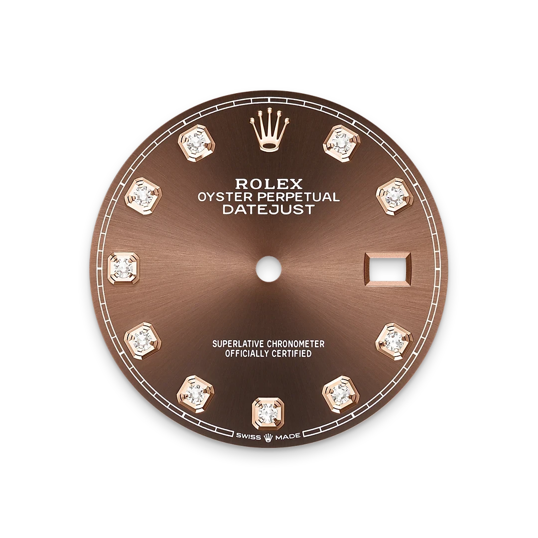 Close-up of a brown Rolex Oyster Perpetual Datejust watch dial featuring diamond hour markers, the Rolex crown logo at 12 o’clock, and a date window at 3 o’clock.