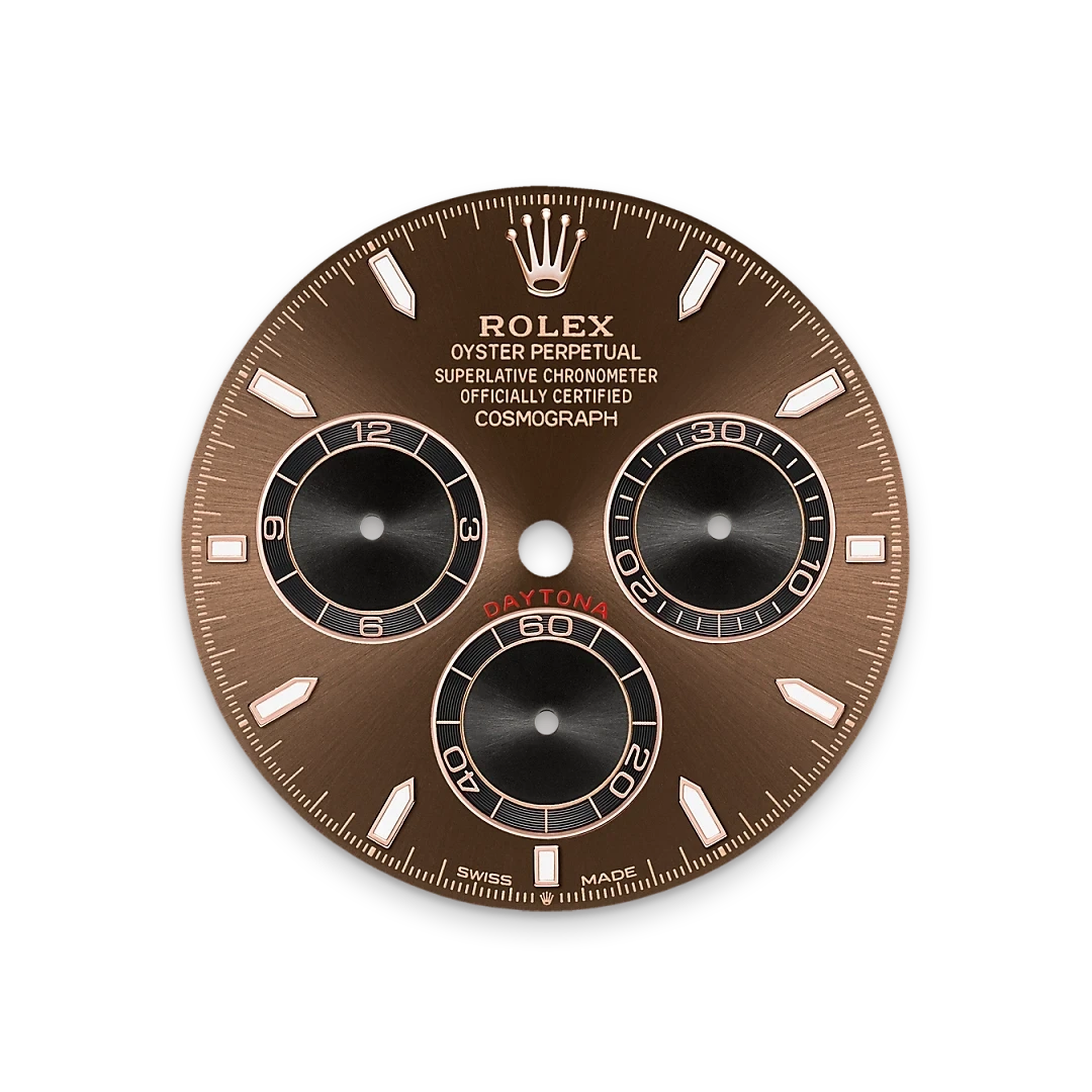 Close-up of a Rolex Daytona watch face with a brown dial featuring three black subdials, white hour markers, the Rolex crown logo, and text highlighting its certification as a superlative chronometer and cosmograph.