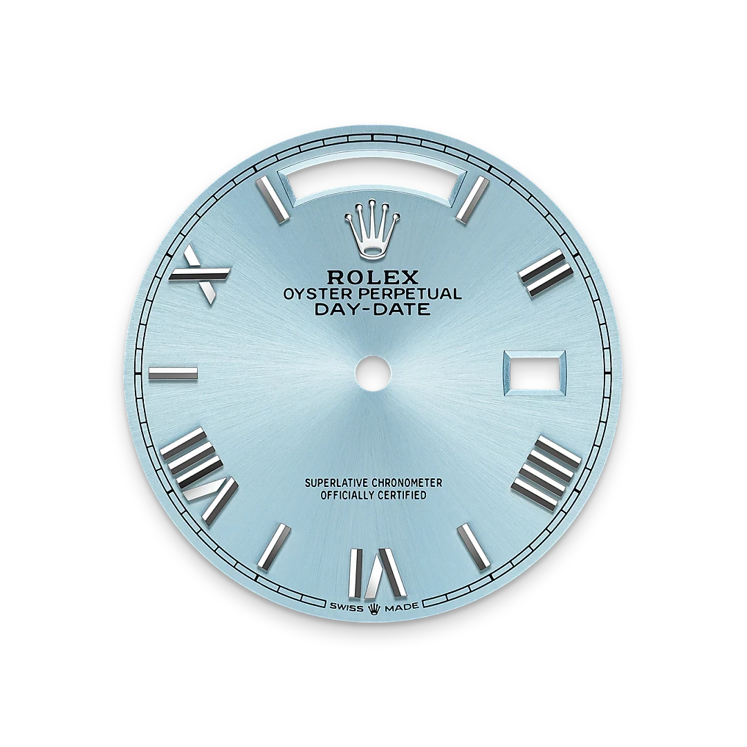 Close-up of a light blue Rolex Oyster Perpetual Day-Date watch dial featuring silver Roman numeral hour markers and the Rolex crown logo at the top.