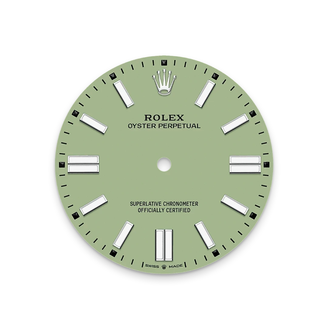 Close-up of a green Rolex Oyster Perpetual watch dial with white hour markers and the Rolex crown logo at the top, highlighting luxury watch craftsmanship.