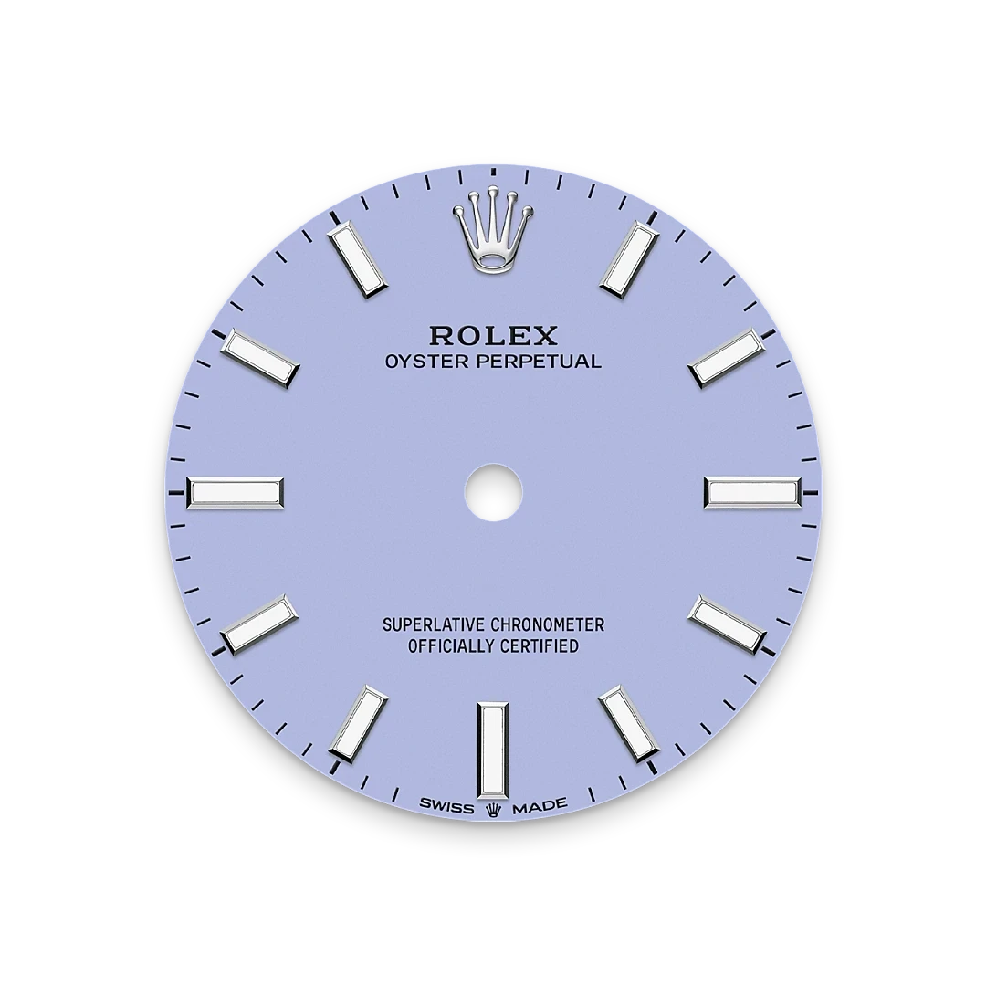 Close-up of a light blue Rolex Oyster Perpetual watch dial featuring silver hour markers, the Rolex crown logo at 12 o'clock, and text indicating Swiss made and chronometer certification.