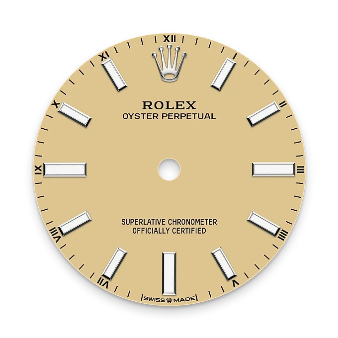 Beige Rolex Oyster Perpetual watch dial with silver hour markers, Roman numerals on the outer edge, Rolex crown logo at 12 o'clock, and text indicating Swiss made and certified chronometer.