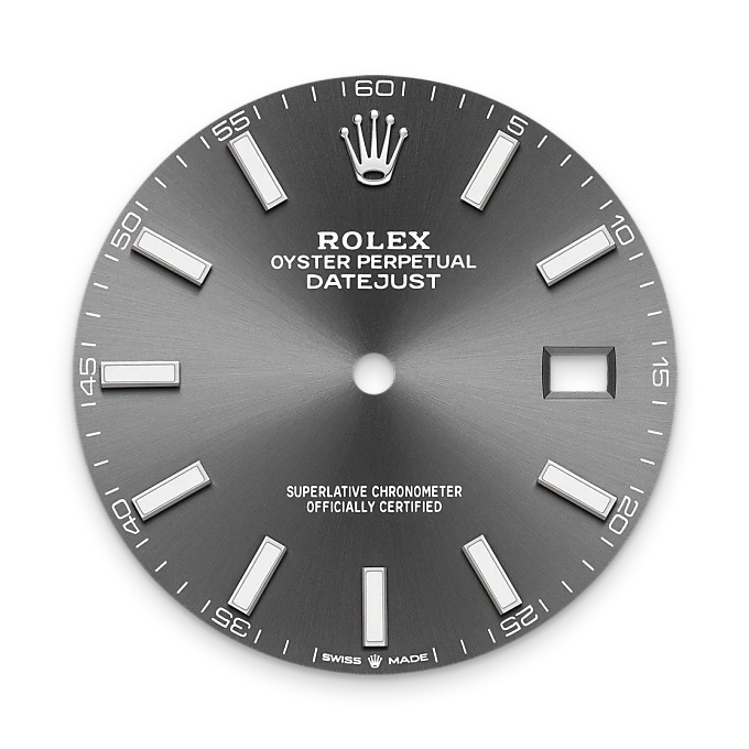 Close-up of a gray metallic Rolex Oyster Perpetual Datejust watch dial featuring luminescent hour markers, minute markers along the edge, and a date window at 3 o’clock, highlighting luxury and precision.