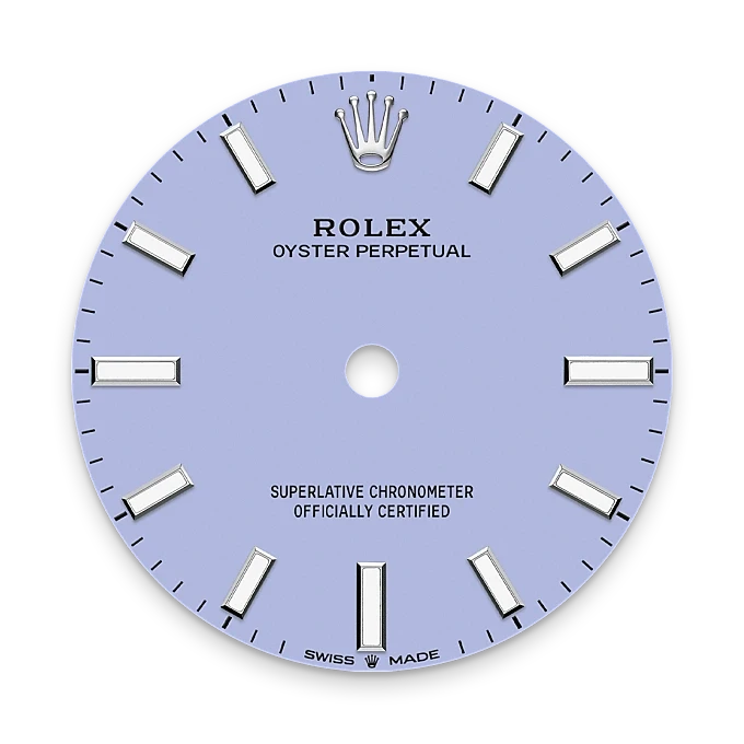 Close-up of a light blue Rolex Oyster Perpetual watch dial featuring silver hour markers, the Rolex crown logo at 12 o’clock, and text indicating it is a superlative chronometer officially certified and Swiss made.
