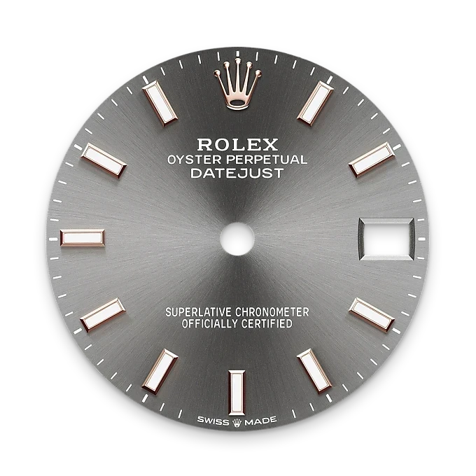 Close-up view of a gray Rolex Oyster Perpetual Datejust watch dial featuring rose gold hour markers, a date window, and the Rolex crown logo at the 12 o'clock position.