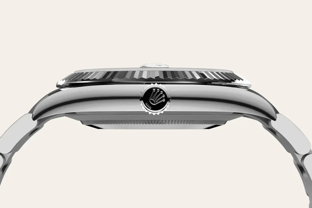 Close-up side view of a luxury Rolex watch showcasing the polished stainless steel case, fluted bezel, and the Rolex crown on the winding crown, highlighting fine craftsmanship.