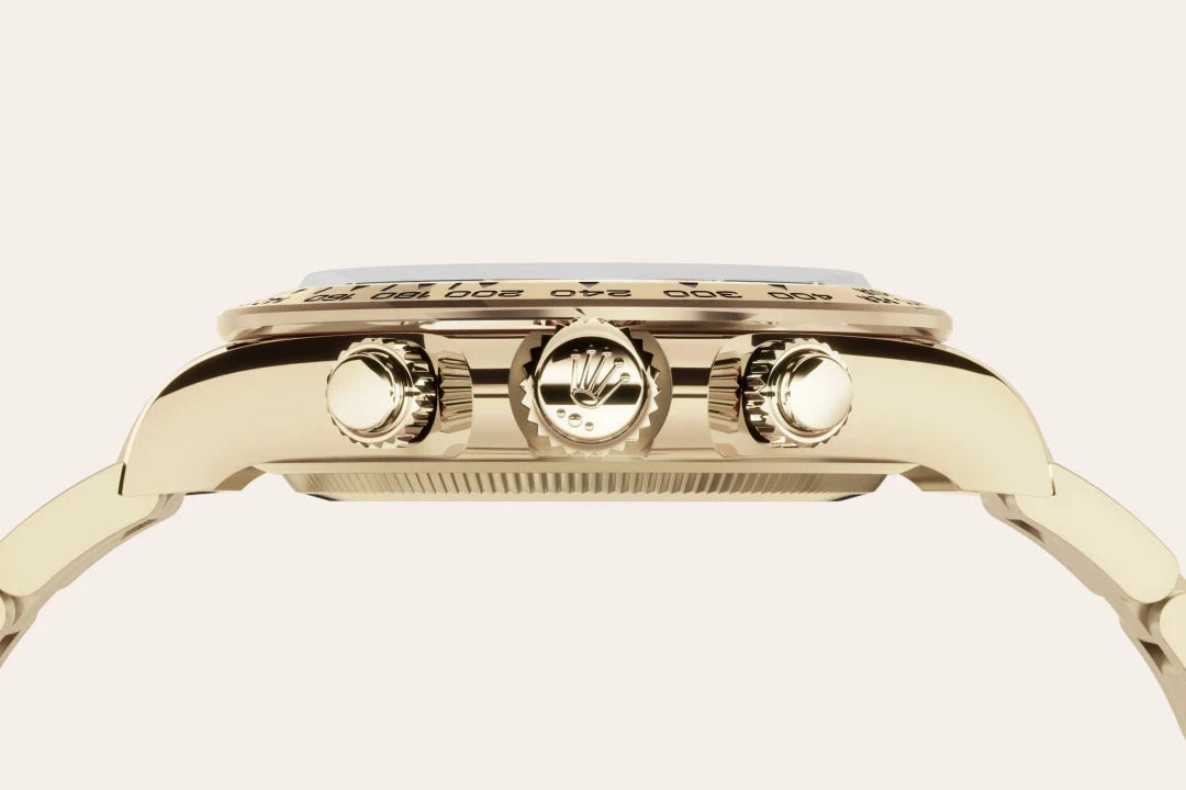 Close-up side view of a luxury gold wristwatch showing three control crowns, highlighting detailed craftsmanship and fine jewelry design.