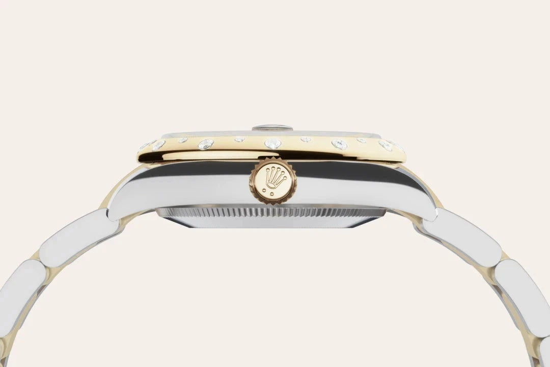 Close-up side view of a luxury two-tone watch with a gold crown featuring the Rolex logo and a polished stainless steel and gold bracelet, highlighting fine craftsmanship.