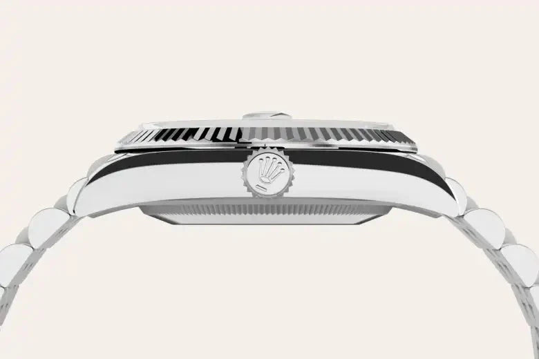 Side profile view of a silver Rolex watch showcasing the fluted bezel, crown logo on the winding crown, and polished metal bracelet, highlighting luxury craftsmanship.