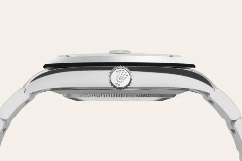 Side view of a sleek luxury watch with a polished metal case and a crown featuring the Rolex logo, highlighting fine craftsmanship and elegant design.