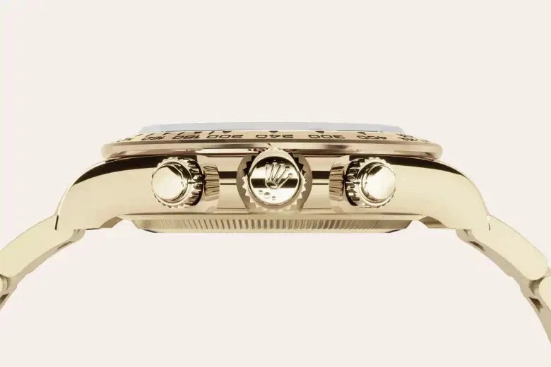 Close-up side view of a luxury gold watch crown and chronograph buttons showcasing fine detailing and craftsmanship, representing expert watch repair and luxury jewelry care.