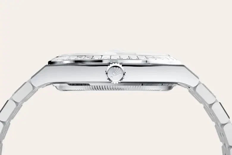 Side profile view of a sleek silver luxury watch with a polished metal bracelet and a detailed crown for time adjustment, highlighting fine craftsmanship and design.