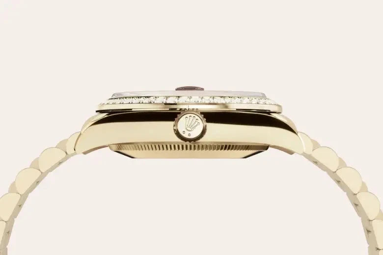 Close-up side view of a luxury gold watch with a diamond-encrusted bezel and signature crown, showcasing fine craftsmanship and elegant design.