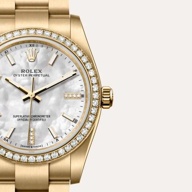 rolex oyster perpetual in 18 ct yellow gold, M124248RBR-0001 - henne jewelers