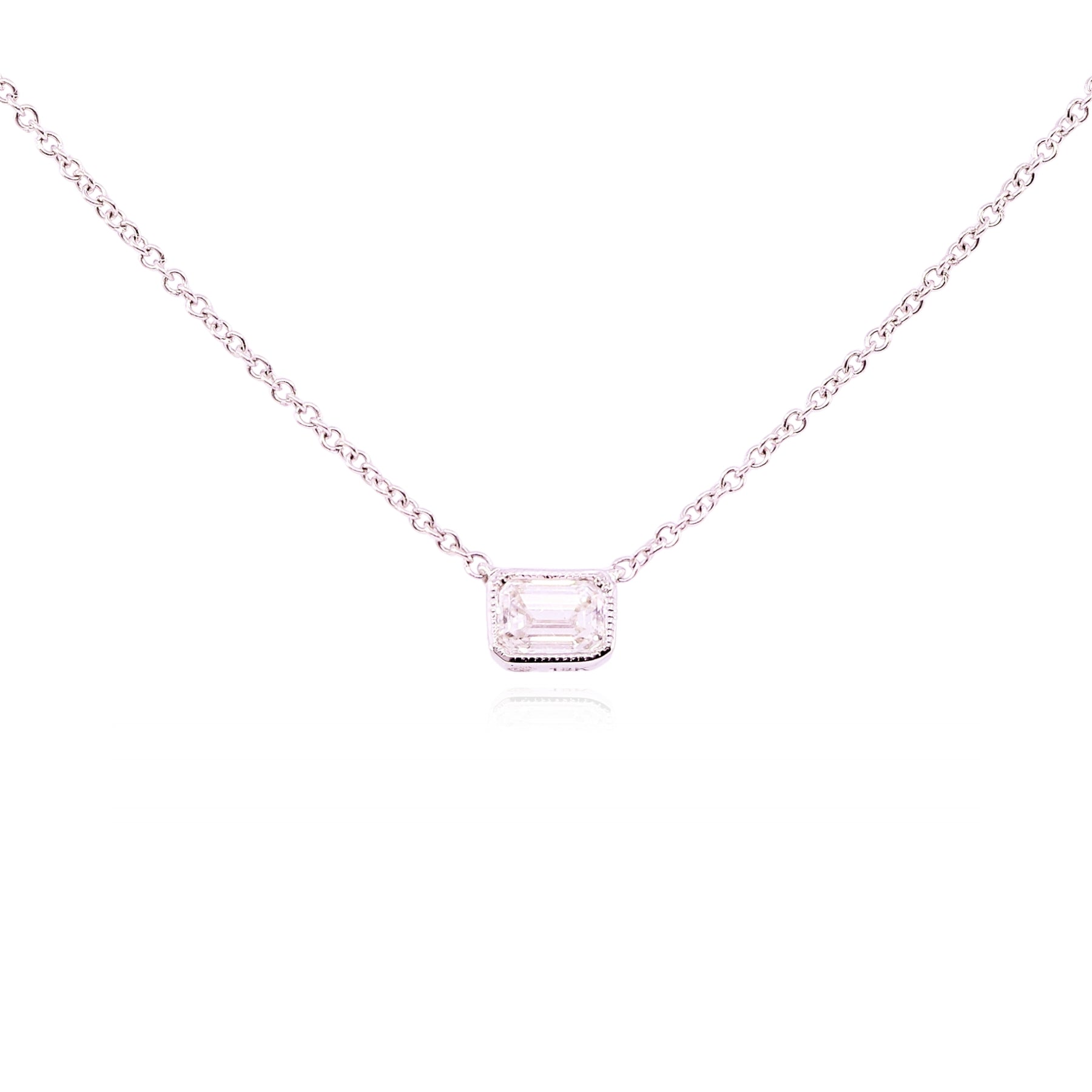 18K WHITE GOLD EMERALD-CUT DIAMOND SOLITAIRE PENDANT NECKLACE - 0.30CT