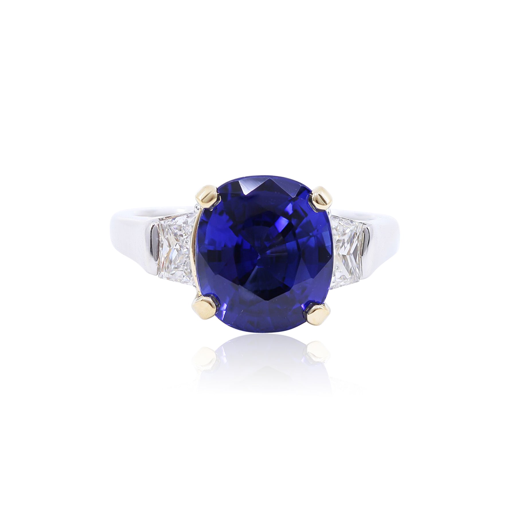 PLATINUM AND 18K YELLOW GOLD CUSHION-CUT SAPPHIRE AND DIAMOND THREE-STONE RING