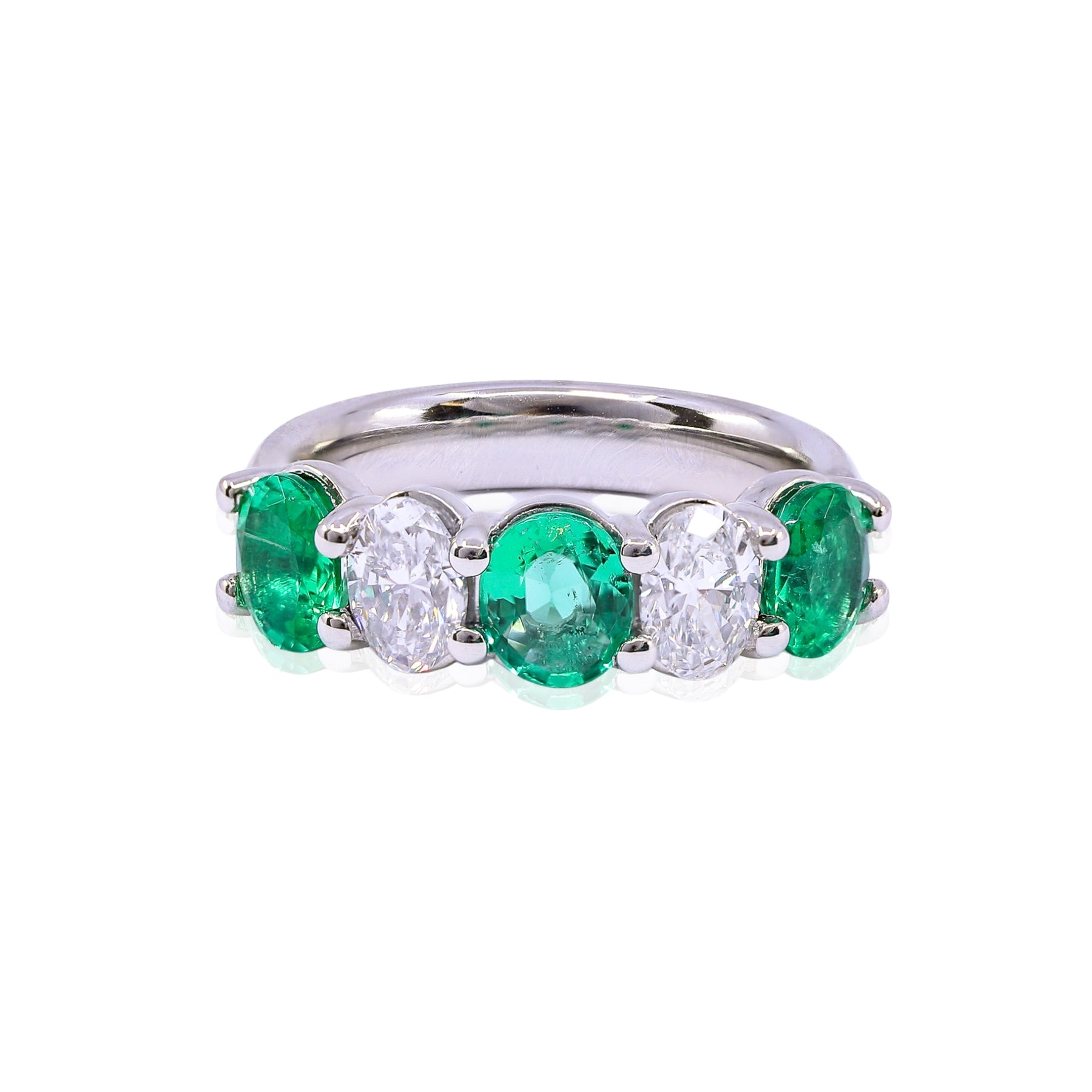PLATINUM OVAL EMERALD AND DIAMOND RING