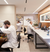 3 Men in White Lab Coats at Desks in Rolex Service Area