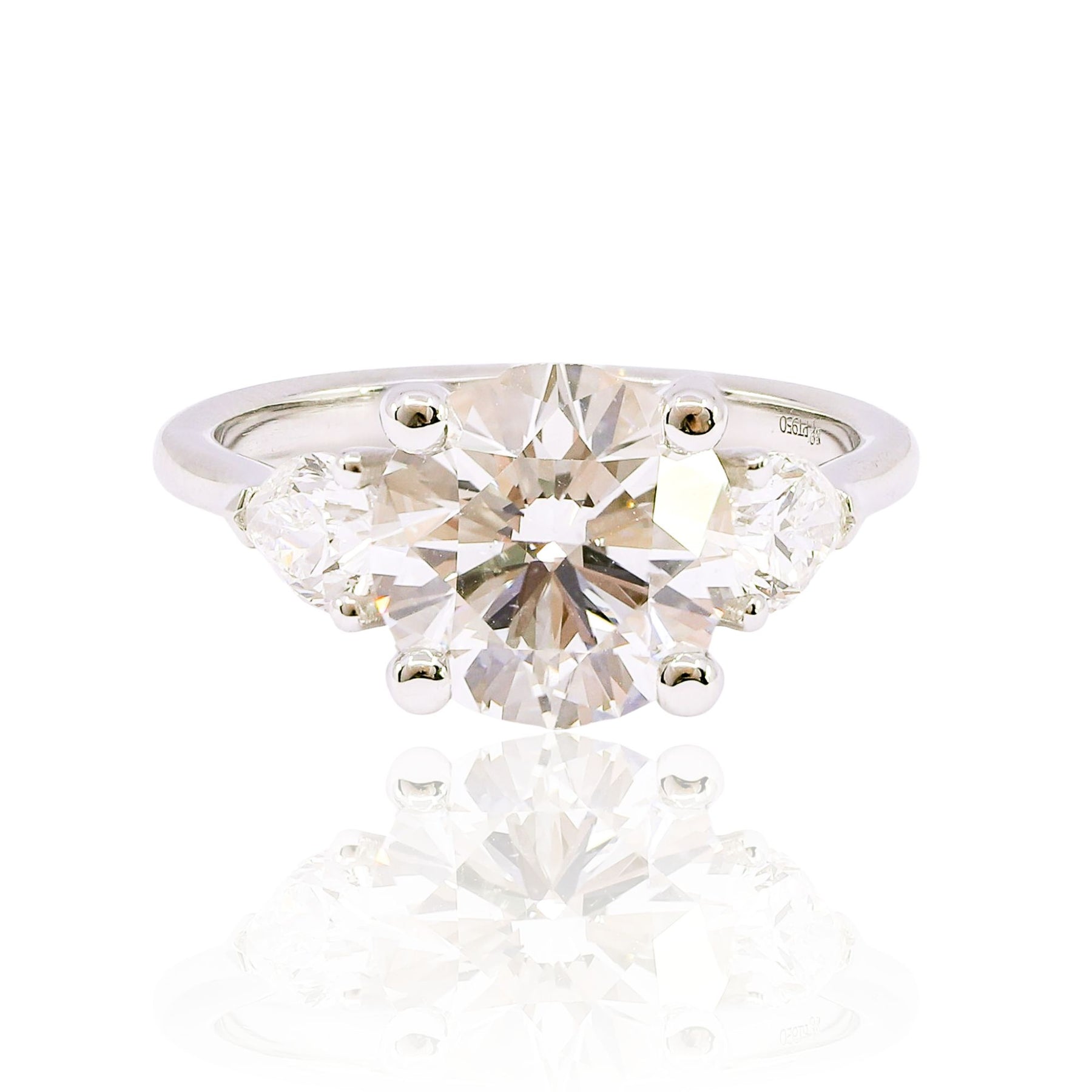 MARK PATTERSON PLATINUM THREE-STONE ROUND BRILLIANT AND PEAR-SHAPE DIAMOND ENGAGEMENT RING